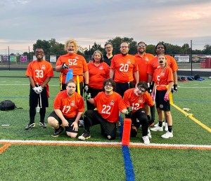 flag football team in orange jerseys